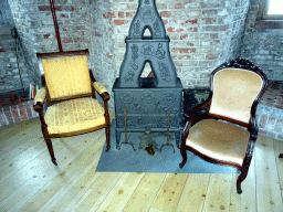 Stove and chairs in the Torenvalkkamer room in the Tower of Castle Sterkenburg
