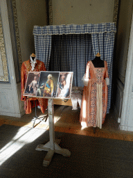 Costumes, bed and photographs of paintings at a room at the east side of the Drottningholm Palace Theatre
