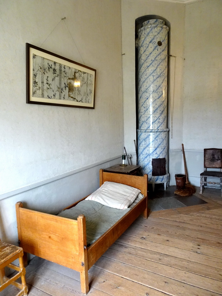 Bed and stove at a room at the east side of the Drottningholm Palace Theatre