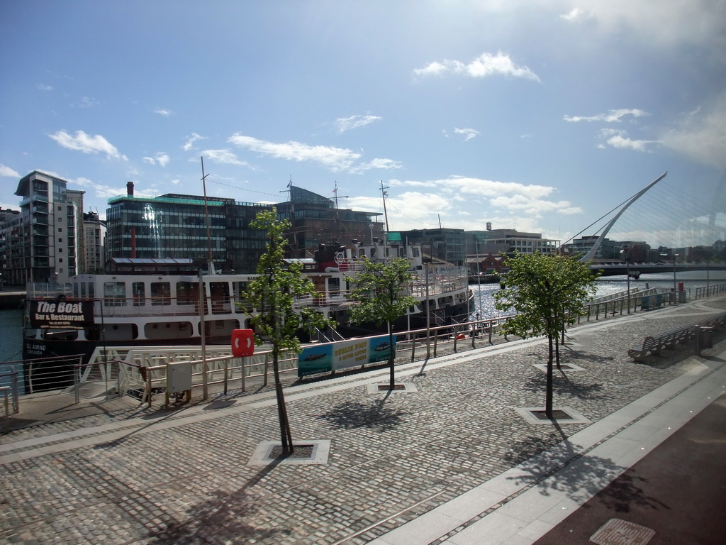 The North Wall Quay, the MV Cill Airne boat restaurant, and the Samuel Beckett Bridge over the Liffey river, viewed from the Airline Express bus from the airport