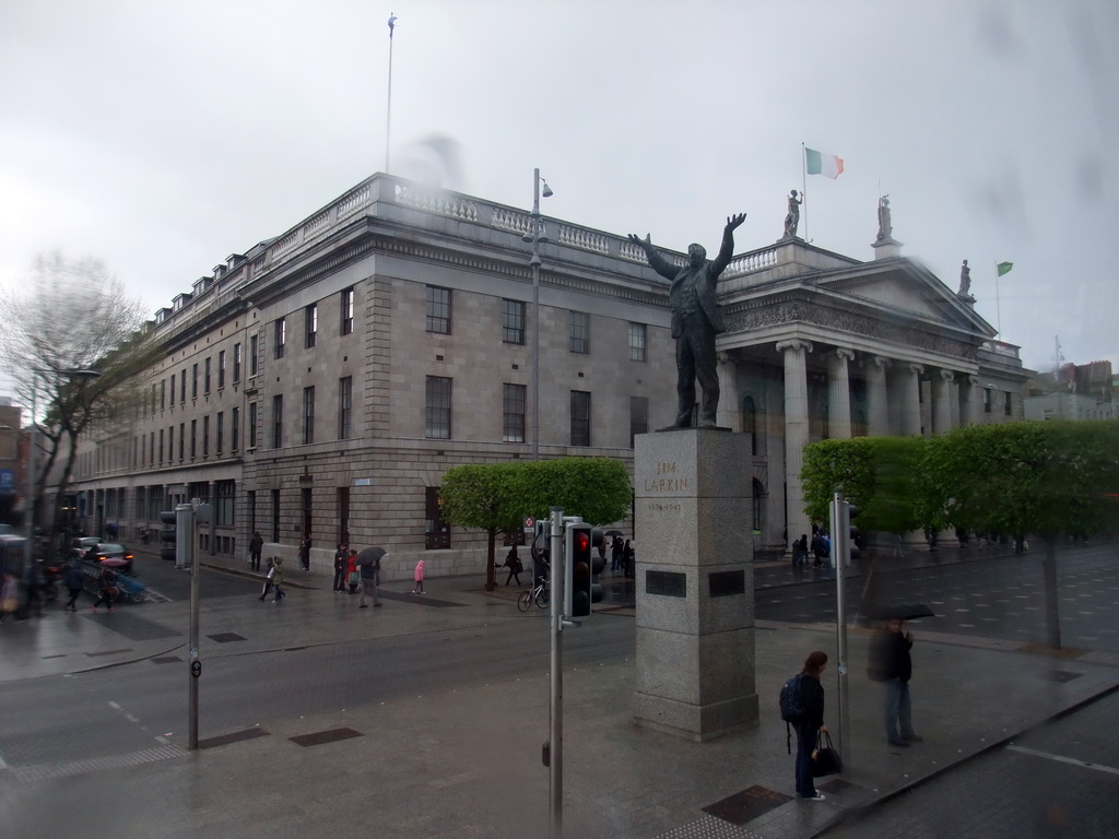 Statue of Jim Larkin and the General Post Office at O`Connell Street, viewed from the Airline Express bus from the airport