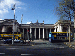 The south side of the Irish Houses of Parliament (Bank of Ireland) and two buses at College Green