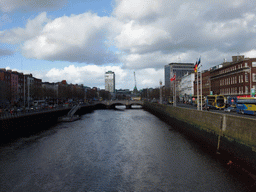 View from the Ha`penny Bridge over the O`Connell Bridge over the Liffey river, the Liberty Hall and the Custom House