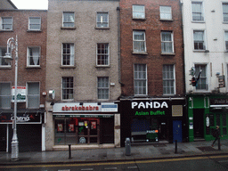 Shops and restaurants in Dame Street, viewed from the sightseeing bus
