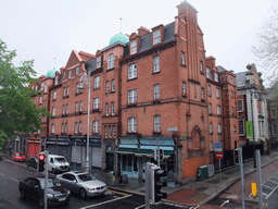 Shops at the crossing of Patrick Street and Bull Alley Street, viewed from the sightseeing bus