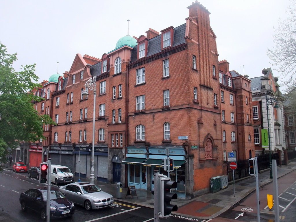 Shops at the crossing of Patrick Street and Bull Alley Street, viewed from the sightseeing bus