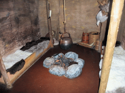Viking house with beds and a campfire, and a wax statue, in Dublinia
