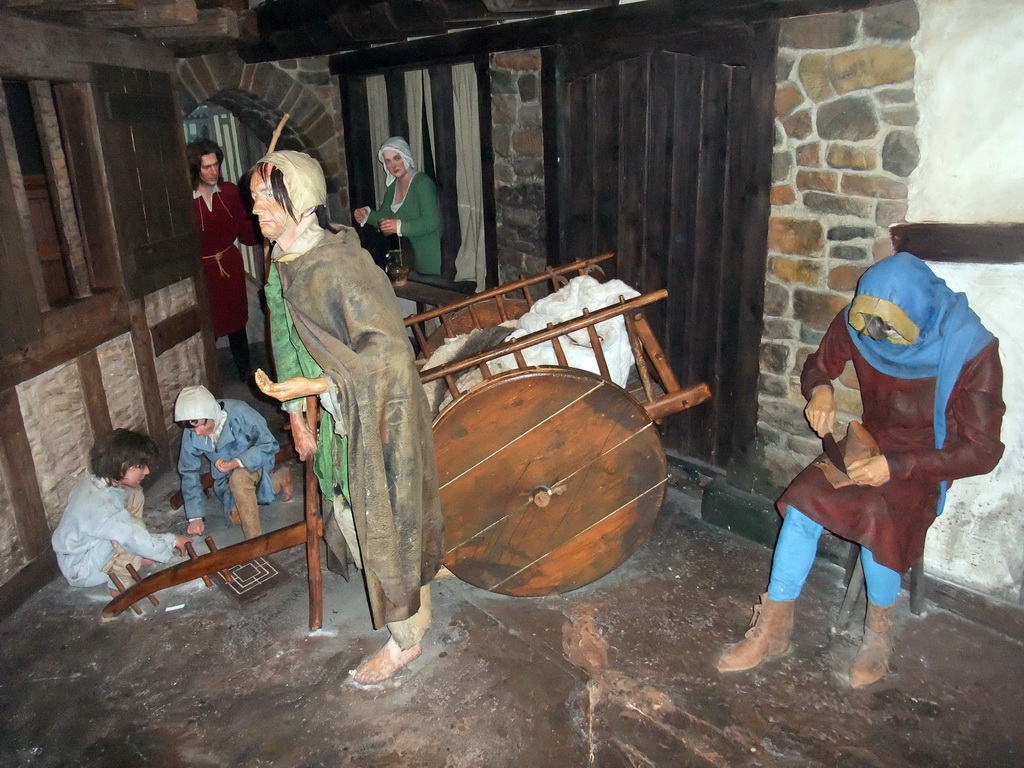 Wax statues and a cart, in Dublinia