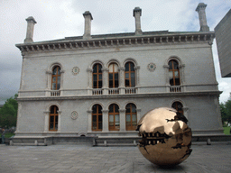 `Sfera con sfera` sculpture by Arnaldo Pomodoro and the side of the Museum Building at Trinity College Dublin