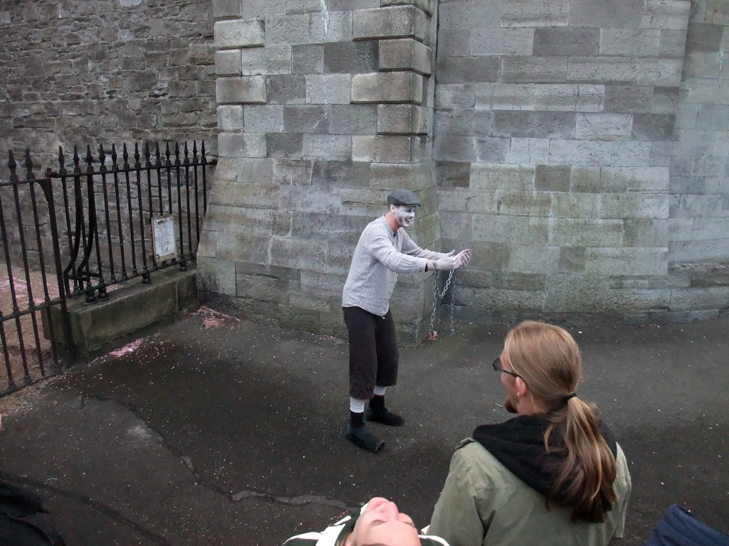 Gravedigger Ghost Tour actor in front of the Kilmainham Gaol museum