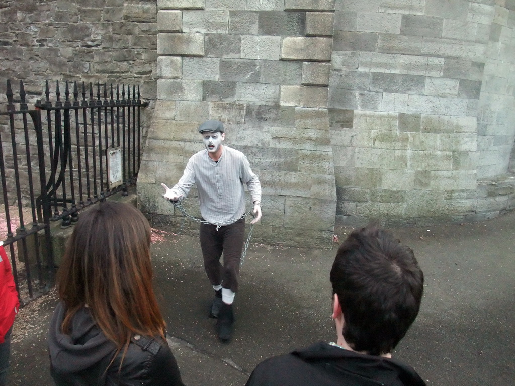 Gravedigger Ghost Tour actor in front of the Kilmainham Gaol museum