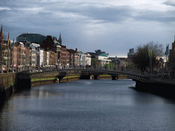 The Ha`penny Bridge over the Liffey river, viewed from the O`Connell Bridge