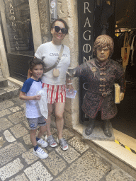 Miaomiao and Max with a statue of Tyrion Lannister in front of the Dragon`s Cave store at the Bokoviceva Ulica street
