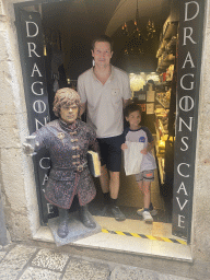 Tim and Max with a statue of Tyrion Lannister in front of the Dragon`s Cave store at the Bokoviceva Ulica street