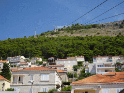 Houses at the Ulica Kralja Petra Kreimira IV street and Mount Srd with the upper station of the Dubrovnik Cable Car, viewed from the lower station