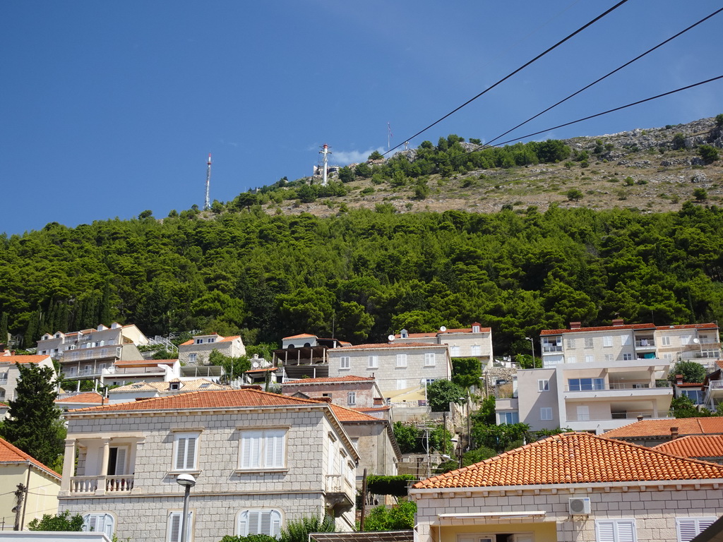Houses at the Ulica Kralja Petra Kreimira IV street and Mount Srd with the upper station of the Dubrovnik Cable Car, viewed from the lower station