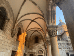 Loggia at the front of the Rector`s Palace and the Dubrovnik Cathedral at the Ulica Pred Dvorom street