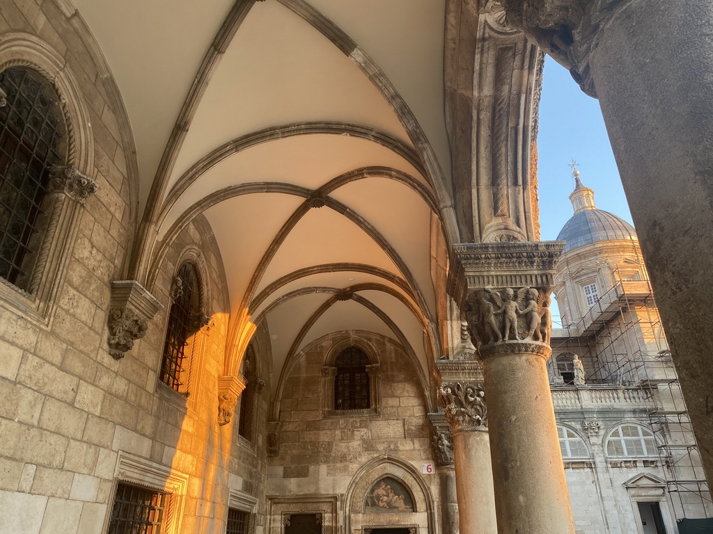 Loggia at the front of the Rector`s Palace and the Dubrovnik Cathedral at the Ulica Pred Dvorom street