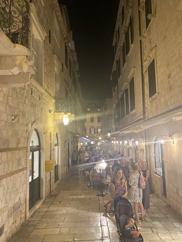 The north side of the iroka Ulica street, viewed from the Ulica od Puca street, by night