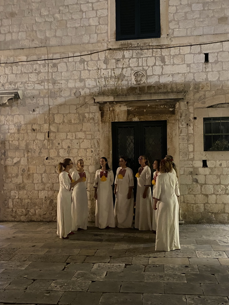 Choir at the Poljana Pasko Milicevica square, by night