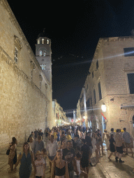 The Stradun street with the tower of the Franciscan Church and the Bell Tower, by night