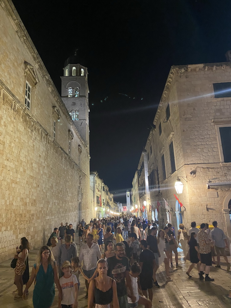 The Stradun street with the tower of the Franciscan Church and the Bell Tower, by night