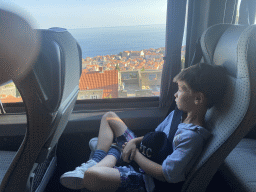 Max at the bus to the Dubrovnik Airport on the Jadranska Cesta road, with a view on the Old Town