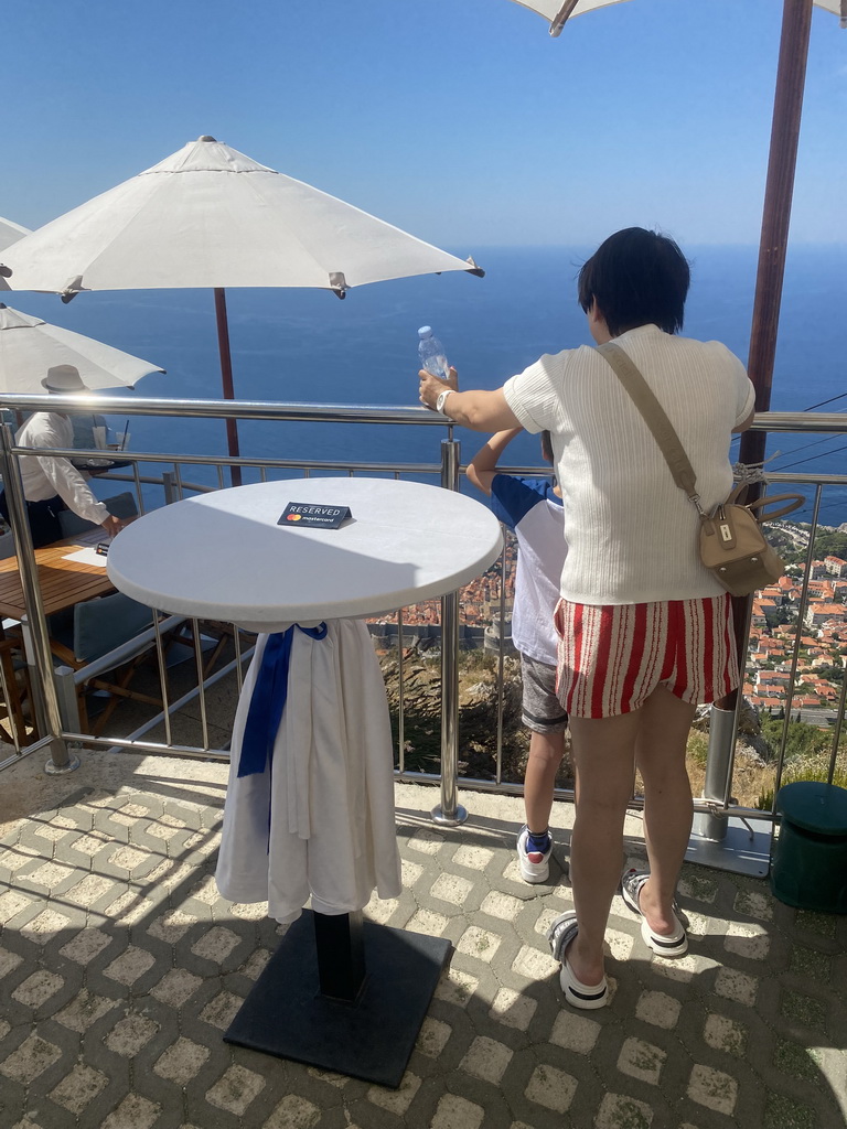 Miaomiao and Max on the terrace of the Restaurant Panorama at Mount Srd, with a view on the Old Town