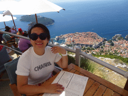 Miaomiao at the terrace of the Restaurant Panorama at Mount Srd, with a view on the Old Town, Fort Lovrijenac and the Lokrum island