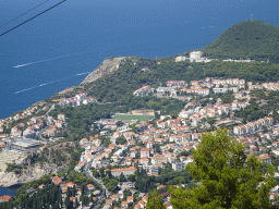 The Lapad peninsula with the football field of NK GOK Dubrovnik 1919, the Rixos Premium Dubrovnik hotel and the Velika Petka Hill, viewed from the terrace of the Restaurant Panorama at Mount Srd