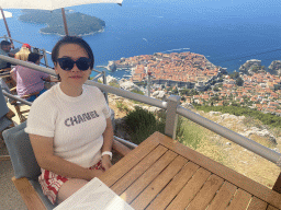 Miaomiao at the terrace of the Restaurant Panorama at Mount Srd, with a view on the Old Town, Fort Lovrijenac and the Lokrum island