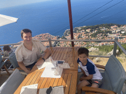 Tim and Max at the terrace of the Restaurant Panorama at Mount Srd, with a view on the Old Town and Fort Lovrijenac