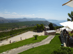 The terrace of the Restaurant Panorama at Mount Srd, the hills and mountains to the east and the town of Cavtat