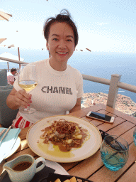 Miaomiao having lunch at the terrace of the Restaurant Panorama at Mount Srd, with a view on the Old Town
