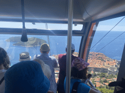 Interior of the Dubrovnik Cable Car, with a view on the Old Town with the Tvrdava Minceta fortress and the Lokrum island, viewed from the Dubrovnik Cable Car