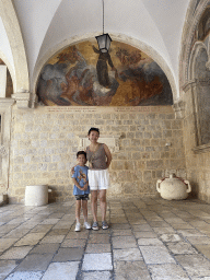 Miaomiao and Max with a fresco at the Franciscan Monastery