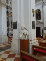 Statue with flowers at the transept of the Dubrovnik Cathedral