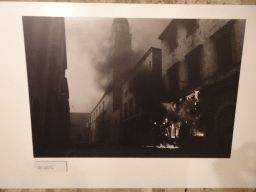 Photograph of the Stradun street with the tower of the Franciscan Church at the `War Photographs` exposition at the lower floor of the Rector`s Palace, with explanation