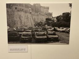 Photographs of burnt down cars at Bua at the `War Photographs` exposition at the lower floor of the Rector`s Palace, with explanation