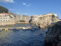 Pier and boats at the Dubrovnik West Harbour, the Tvrdava Bokar fortress, Kolorina Bay and kayaks at Bokar Beach