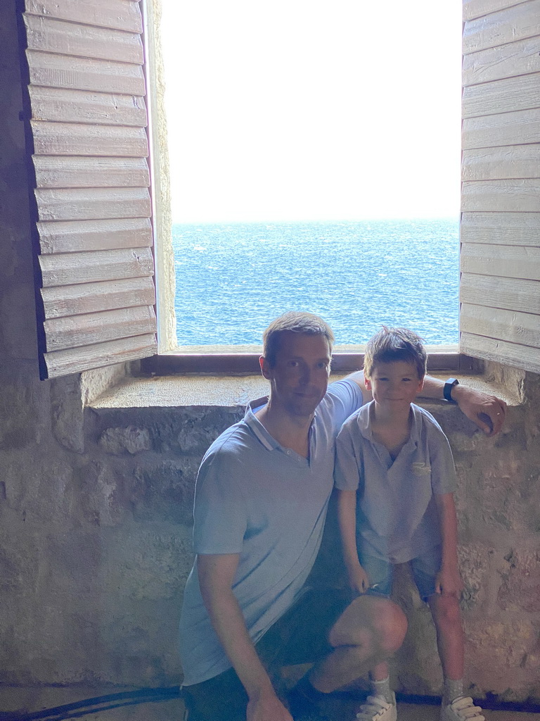 Tim and Max at a window at the backstage area of the theatre at the ground floor of Fort Lovrijenac