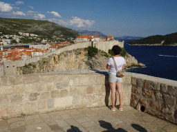 Miaomiao at the second floor of Fort Lovrijenac, with a view on the Old Town with the southwestern city walls and the Lokrum island