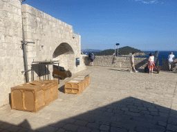 Cannons and chests at the third floor of Fort Lovrijenac, with a view on the Lokrum island