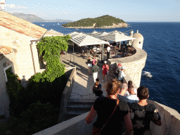 The top of the Kula sv. Petra fortress with the terrace of the Caffe on the Wall restaurant and the Lokrum island
