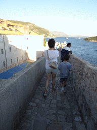 Miaomiao and Max on top of the southern city walls, with a view on the Kula sv. Margarita fortress, a sports field at the back side of the Collegium Ragusinum building and the Lokrum island