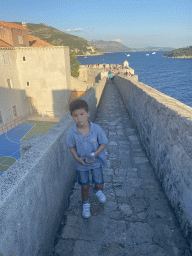 Max on top of the southern city walls, with a view on the Kula sv. Margarita fortress, a sports field at the back side of the Collegium Ragusinum building and the Lokrum island