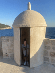 Max at a guard house on top of the Kula sv. Margarita fortress, with a view on the Lokrum island