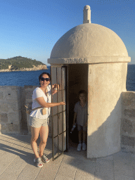 Miaomiao and Max at a guard house on top of the Kula sv. Margarita fortress, with a view on the Lokrum island