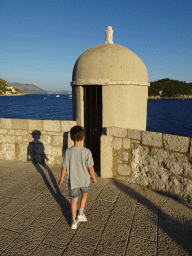 Max at a guard house on top of the Kula sv. Stjepan fortress, with a view on the Lokrum island