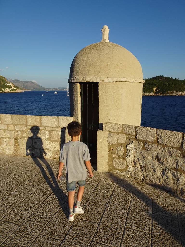 Max at a guard house on top of the Kula sv. Stjepan fortress, with a view on the Lokrum island